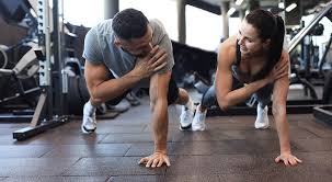 Toning Bingo Wings: Your Ultimate Guide to Sculpting Sleek Arms at the Gym 3 Fitness trainer demonstrating arm toning exercises Salisbury